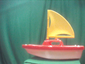 90 Degrees _ Picture 9 _ Red and Yellow Toy Sailboat.png